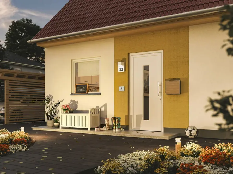 Das Einfamilienhaus Flair 113 mit Blick auf den Eingangsbereich und farblichem Besenzug als Akzent